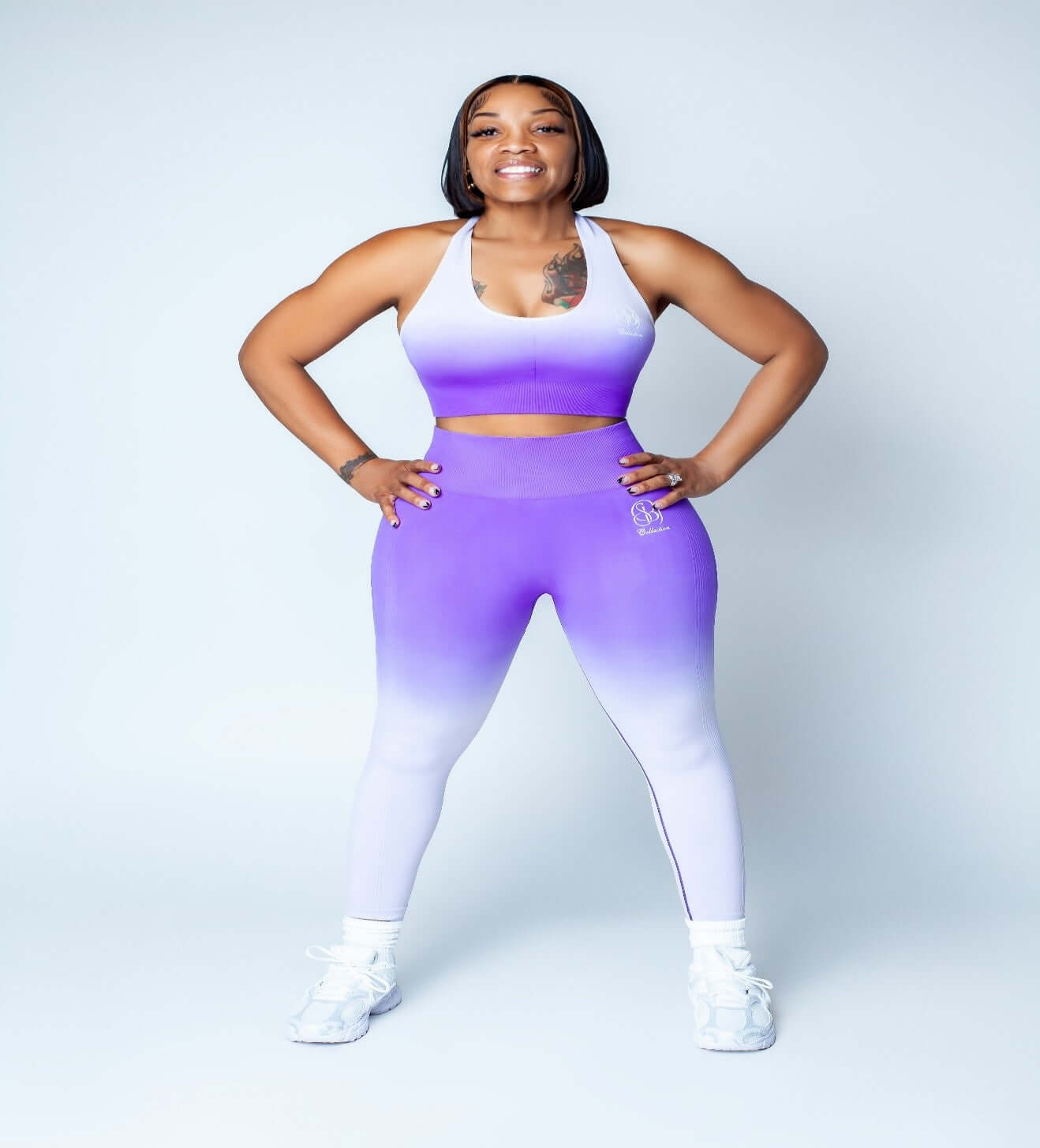 Cotton Candy Luxe Set showcased by a woman posing in a purple ombre, highlighting premium comfort loungewear.