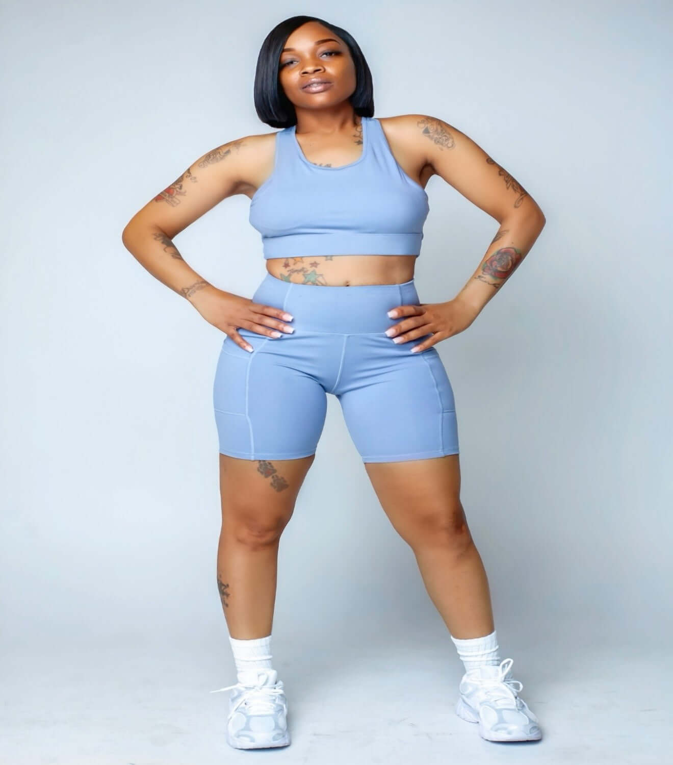Model showcasing the Serenity Sculpt Set in a light blue seamless shapewear and body contouring outfit.